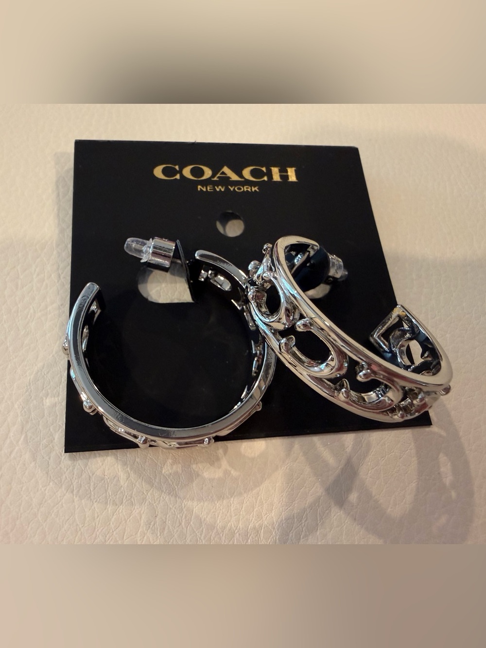 Coach Silver-Tone Cutout Hoop Earrings with Black Interior